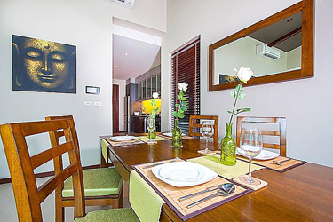 Dining and Kitchen Area with Garden and Pool View